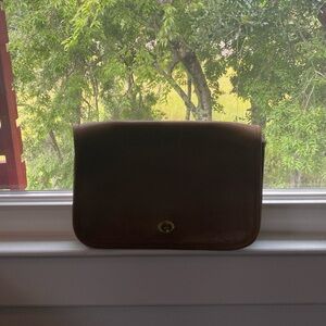 Vintage brown leather Coach clutch with strap clips. Needs a clean